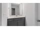 Bathroom featuring a vanity with storage and a large mirror at 257 North Maple Walk Dr # 218, Garner, NC 27529