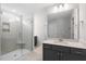 Modern bathroom featuring a glass enclosed shower with tile surround and vanity sink at 257 North Maple Walk Dr # 218, Garner, NC 27529