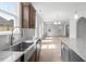 Kitchen with stainless steel sink and island that overlooks the dining room at 257 North Maple Walk Dr # 218, Garner, NC 27529