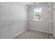 Carpeted walk-in closet with wire shelving and a window at 257 North Maple Walk Dr # 218, Garner, NC 27529