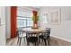 Dining area with round table and four black chairs at 285 Moyer Dr # 119, Graham, NC 27253