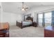 Main bedroom featuring a large bed and ceiling fan at 326 Armistead Ct, Burlington, NC 27217
