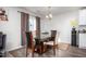Dining area with glass-top table and four chairs at 326 Armistead Ct, Burlington, NC 27217