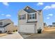 Two-story house featuring gray siding, a white double garage door, and a small front yard at 326 Armistead Ct, Burlington, NC 27217