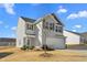 Two-story house, gray siding, attached garage, and landscaping at 326 Armistead Ct, Burlington, NC 27217