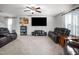 Open living area featuring comfortable leather sofas and a large TV at 326 Armistead Ct, Burlington, NC 27217