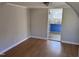Bright dining area with hardwood floors and view into kitchen at 3612 Mt Zion Church Rd, Mebane, NC 27302