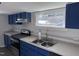 Modern kitchen with blue cabinets and stainless steel appliances at 3612 Mt Zion Church Rd, Mebane, NC 27302