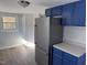 Modern kitchen with blue cabinets and stainless steel appliances at 3612 Mt Zion Church Rd, Mebane, NC 27302
