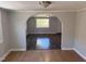 Open living area with wood floors and arched doorway at 3612 Mt Zion Church Rd, Mebane, NC 27302