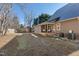 Large backyard with patchy grass and visible AC units at 402 W Clay St, Mebane, NC 27302