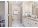 Double vanity bathroom with granite countertops and a tiled floor at 402 W Clay St, Mebane, NC 27302