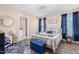 Cozy bedroom with a queen-size bed and en-suite bathroom access at 402 W Clay St, Mebane, NC 27302
