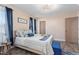 Spacious bedroom with a queen-size bed and blue accents at 402 W Clay St, Mebane, NC 27302