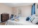 Bright bedroom with a comfortable bed and en-suite bathroom at 402 W Clay St, Mebane, NC 27302