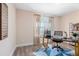 Bright home office with built-in shelving and hardwood floors at 402 W Clay St, Mebane, NC 27302