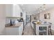 Modern kitchen with white cabinets, granite countertops, and mosaic backsplash at 402 W Clay St, Mebane, NC 27302