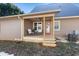 Back porch with rocking chairs and access to the yard at 402 W Clay St, Mebane, NC 27302