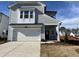 Charming two-story home with a white garage door and beautifully contrasting trim against a light gray exterior at 4321 Darius Ln # 23, Fuquay Varina, NC 27526