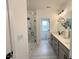 Bathroom featuring double sinks, a glass-enclosed shower, and modern fixtures at 4321 Darius Ln # 23, Fuquay Varina, NC 27526