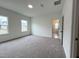 Comfortable bedroom with soft carpeting, bathed in natural light from two large windows at 4321 Darius Ln # 23, Fuquay Varina, NC 27526