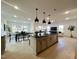 Bright, open kitchen with island and adjacent living and dining spaces at 4321 Darius Ln # 23, Fuquay Varina, NC 27526