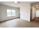 Bright living room features wood floors, a large window, and access to other areas of the home at 4321 Darius Ln # 23, Fuquay Varina, NC 27526