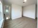 Spacious living area with wood floors, offering views of the staircase and abundant natural light at 4321 Darius Ln # 23, Fuquay Varina, NC 27526