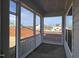 A covered porch showcasing the outdoor living space with a view of the neighborhood at 4321 Darius Ln # 23, Fuquay Varina, NC 27526