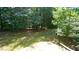 Secluded backyard featuring mature trees providing shade and privacy at 5366 Patuxent Dr, Raleigh, NC 27616