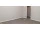 Spacious bedroom with plush carpeting and walk-in closet at 572 Glenkirk Pl, Garner, NC 27529