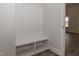 Built-in bench with storage and hooks in entryway at 572 Glenkirk Pl, Garner, NC 27529
