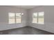 Bright dining room with hardwood floors, wainscoting, and chandelier at 572 Glenkirk Pl, Garner, NC 27529