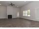 Living room with hardwood floors, fireplace, and access to other rooms at 572 Glenkirk Pl, Garner, NC 27529