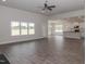 Spacious living room with hardwood floors, ceiling fan, and fireplace at 572 Glenkirk Pl, Garner, NC 27529