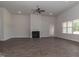 Living room with hardwood floors, fireplace, and access to other rooms at 572 Glenkirk Pl, Garner, NC 27529