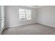 Bedroom with carpeted floors and a double hung window at 704 Georgia'S Landing Pkwy # 15, Raleigh, NC 27603