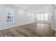 Bright bedroom with hardwood flooring, large windows, and recessed lighting at 704 Georgia'S Landing Pkwy # 15, Raleigh, NC 27603