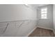 Walk-in closet with wire shelving and lots of storage space at 704 Georgia'S Landing Pkwy # 15, Raleigh, NC 27603
