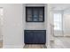 Dining area with built-in cabinetry and serving station with subway tile backsplash at 704 Georgia'S Landing Pkwy # 15, Raleigh, NC 27603
