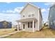 Exterior of a two-story home with gray siding and a covered porch at 704 Georgia'S Landing Pkwy # 15, Raleigh, NC 27603