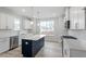 Modern kitchen featuring white cabinets, stainless steel appliances, and a center island at 704 Georgia'S Landing Pkwy # 15, Raleigh, NC 27603