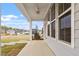 Covered porch featuring white ceiling fan and view of community at 704 Georgia'S Landing Pkwy # 15, Raleigh, NC 27603