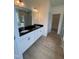 Elegant bathroom featuring double sinks, granite countertops, and a glass-enclosed shower at 93 Ausban Ridge Ln # 033, Four Oaks, NC 27524