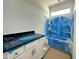 Bathroom features a white vanity with a black countertop and a tub/shower with blue protective plastic wrap at 93 Ausban Ridge Ln # 033, Four Oaks, NC 27524