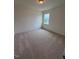 A carpeted bedroom with natural light from the window at 93 Ausban Ridge Ln # 033, Four Oaks, NC 27524