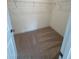 Walk-in closet offering ample storage with shelves and carpet flooring at 93 Ausban Ridge Ln # 033, Four Oaks, NC 27524