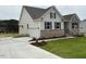 Beautiful single-Gathering home showcasing a concrete driveway and lush green lawn at 93 Ausban Ridge Ln # 033, Four Oaks, NC 27524