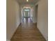 Inviting hallway with detailed trim and wood-look tile leading to the front door, highlighting craftsmanship at 93 Ausban Ridge Ln # 033, Four Oaks, NC 27524