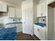 White cabinets and an island with lots of storage space are highlighted in this kitchen view at 93 Ausban Ridge Ln # 033, Four Oaks, NC 27524